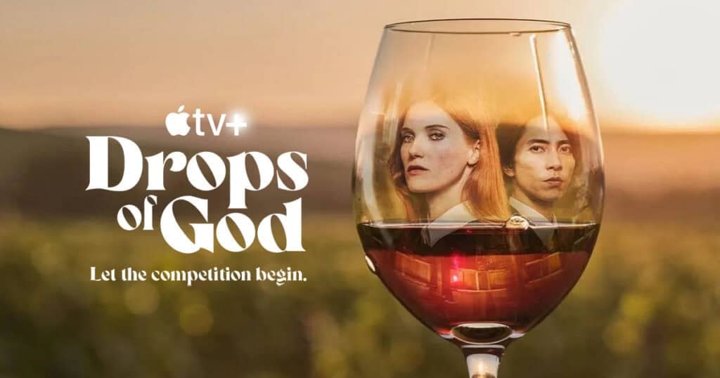 Apple TV+ promotional art for "Drops of God" showing two lead actors reflected inside a glass of red wine against a sunlit vineyard, with the tagline "Let the competition begin.